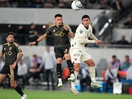 Mar 10, 2026; Los Angeles, California, USA; LAFC midfielder Mark Delgado (8) and LD Alajuelense midfielder Alejandro Bran (14) battle for the ball in the second half of Concacaf Champions Cup-Round of 16 game at BMO Stadium. Mandatory Credit: Kirby Lee-Imagn Images
