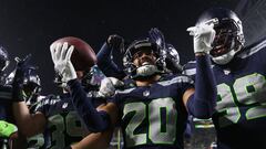 SEATTLE, WASHINGTON - DECEMBER 18: Julian Love #20 of the Seattle Seahawks celebrates with teammates after an interception in the fourth quarter at Lumen Field on December 18, 2023 in Seattle, Washington.   Steph Chambers/Getty Images/AFP (Photo by Steph Chambers / GETTY IMAGES NORTH AMERICA / Getty Images via AFP)