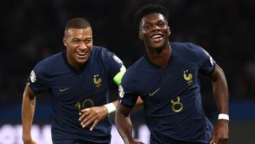 France's midfielder #08 Aurelien Tchouameni celebrates with France's forward #10 Kylian Mbappe after scoring his team's first goal during the UEFA Euro 2024 football tournament Group B qualifying match between France and Republic of Ireland, at the Parc des Princes stadium in Paris, on September 7, 2023. (Photo by FRANCK FIFE / AFP)