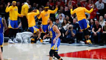 PORTLAND, OR - APRIL 24: The bench players of the Golden State Warriors celebrate a three point shot by Stephen Curry #30 against the Portland Trail Blazers during Game Four of the Western Conference Quarterfinals of the 2017 NBA Playoffs at Moda Center on April 24, 2017 in Portland, Oregon. NOTE TO USER: User expressly acknowledges and agrees that, by downloading and or using this photograph, User is consenting to the terms and conditions of the Getty Images License Agreement.   Jonathan Ferrey/Getty Images/AFP
 == FOR NEWSPAPERS, INTERNET, TELCOS &amp; TELEVISION USE ONLY ==