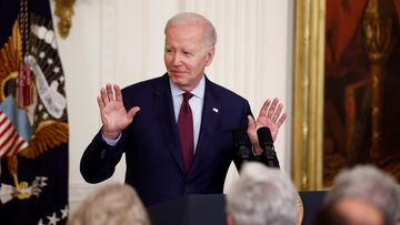 U.S. President Joe Biden announces that he is cutting his upcoming trip to Asia short and will return to Washington earlier than planned to continue U.S. debt ceiling negotiations, during his remarks at a Jewish American Heritage Month celebration at the White House in Washington, U.S., May 16, 2023. REUTERS/Evelyn Hockstein