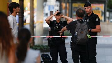 Security personel stand guard after a police officer was injured in an attack next to the Champs-Elysees avenue, in Paris, France July 18, 2024. REUTERS/Abdul Saboor
