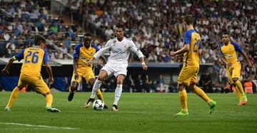 Real Madrid's forward from Portugal Cristiano Ronaldo controls the ball during the UEFA Champions League football match Real Madrid CF vs APOEL FC at the Santiago Bernabeu stadium