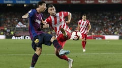 Barcelona&#039;s Argentinian forward Lionel Messi (L) vies with Girona&#039;s Spanish midfielder Borja Garcia during the Spanish league football match between FC Barcelona and Girona FC at the Camp Nou stadium in Barcelona on September 23, 2018. (Photo by