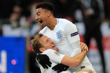 Harry Kane of England celebrates scoring their 2nd goal with Jesse Lingard.