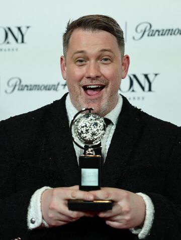 Michael Arden poses with the award for the Best Direction of a Musical for "Parade" at the 76th Annual Tony Awards in New York City, U.S., June 11, 2023. REUTERS/Amr Alfiky