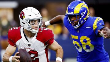INGLEWOOD, CALIFORNIA - NOVEMBER 13: Colt McCoy #12 of the Arizona Cardinals is chased down by Justin Hollins #58 of the Los Angeles Rams in the third quarter of the game at SoFi Stadium on November 13, 2022 in Inglewood, California. Ronald Martinez/Getty Images/AFP