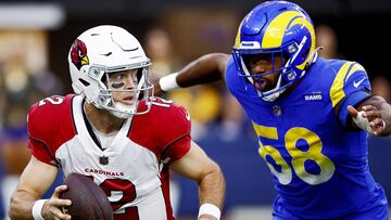 INGLEWOOD, CALIFORNIA - NOVEMBER 13: Colt McCoy #12 of the Arizona Cardinals is chased down by Justin Hollins #58 of the Los Angeles Rams in the third quarter of the game at SoFi Stadium on November 13, 2022 in Inglewood, California.   Ronald Martinez/Getty Images/AFP