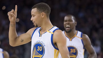 October 21, 2016; Oakland, CA, USA; Golden State Warriors guard Stephen Curry (30) and forward Kevin Durant (35) celebrate after Curry made a three-point basket during the second quarter against the Portland Trail Blazers at Oracle Arena. Mandatory Credit: Kyle Terada-USA TODAY Sports