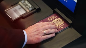 FILE PHOTO: A man scans his passport during a demonstration of the European Union's Entry/Exit System (EES) at the Eurotunnel terminal in Folkestone, Britain, September 23, 2025. REUTERS/Jack Taylor/File Photo