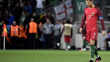 Portugal&#039;s forward Cristiano Ronaldo walks on the pitch during the Euro 2016 group F football match between Portugal and Iceland at the Geoffroy-Guichard stadium in Saint-Etienne on June 14, 2016.