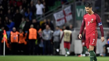 Portugal&#039;s forward Cristiano Ronaldo walks on the pitch during the Euro 2016 group F football match between Portugal and Iceland at the Geoffroy-Guichard stadium in Saint-Etienne on June 14, 2016.