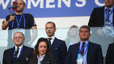 (Centre-row L to R) Olympique Lyonnais' President Jean-Michel Aulas, UEFA President Aleksander Ceferin, and FC Barcelona President Joan Laporta attend the UEFA Women’s Champions League Final football match between Spain's Barcelona and France's Lyon at the Allianz Stadium in the Italian city of Turin on May 21, 2022. (Photo by FRANCK FIFE / AFP)