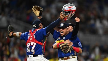 Venezuela's players celebrate after winning the Caribbean Series baseball game against Nicaragua and reaching the semi-finals at LoanDepot Park in Miami, Florida, on February 7, 2024. (Photo by Chandan Khanna / AFP)