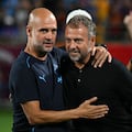 (L-R) Manchester City manager Pep Guardiola greets FC Barcelona manger Hansi Flick during the 2024 FC Series pre-season friendly football match between FC Barcelona and Manchester City at Camping World Stadium in Orlando, Florida, on July 30, 2024. (Photo by CHANDAN KHANNA / AFP)