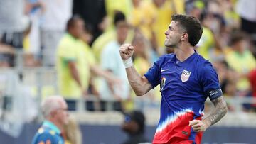 USA's forward #10 Christian Pulisic celebrates scoring his team's first goal during the Continental Clasico 2024 international friendly football match between USA and Brazil at the Camping World Stadium in Orlando, Florida, June 12, 2024. (Photo by Gregg Newton / AFP)