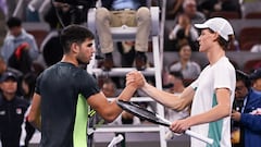 Italy's Jannik Sinner (R) is congratulated by Spain�s Carlos Alcaraz following his victory in their men's singles semifinal match during the China Open tennis tournament at the National Tennis Center in Beijing on October 3, 2023. (Photo by Pedro PARDO / AFP)