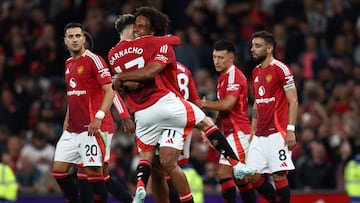 Manchester United's Dutch striker #11 Joshua Zirkzee (C) celebrates with Manchester United's Argentinian midfielder #17 Alejandro Garnacho (2L) after scoring the opening goal of the English Premier League football match between Manchester United and Fulham at Old Trafford in Manchester, north west England, on August 16, 2024. (Photo by Darren Staples / AFP) / RESTRICTED TO EDITORIAL USE. No use with unauthorized audio, video, data, fixture lists, club/league logos or 'live' services. Online in-match use limited to 120 images. An additional 40 images may be used in extra time. No video emulation. Social media in-match use limited to 120 images. An additional 40 images may be used in extra time. No use in betting publications, games or single club/league/player publications. /