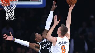 Oct 3, 2017; New York, NY, USA; Brooklyn Nets forward Rondae Hollis-Jefferson (24) defends New York Knicks forward Kristaps Porzingis (6) during the first half at Madison Square Garden. Mandatory Credit: Noah K. Murray-USA TODAY Sports
