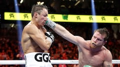 LAS VEGAS, NEVADA - SEPTEMBER 17: Canelo Alvarez (red trunks) lands a punch against Gennadiy Golovkin (white trunks) in the fight for the Super Middleweight Title at T-Mobile Arena on September 17, 2022 in Las Vegas, Nevada.   Sarah Stier/Getty Images/AFP