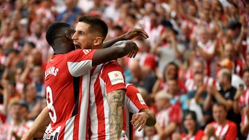Athletic Bilbao's Spanish midfielder #08 Oihan Sancet celebrates with Athletic Bilbao's Spanish forward #09 Inaki Williams scoring his team's first goal during the Spanish league football match between Athletic Club Bilbao and Getafe CF at the San Mames stadium in Bilbao on August 15, 2024. (Photo by ANDER GILLENEA / AFP)