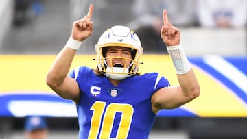 INGLEWOOD, CA - DECEMBER 18: Los Angeles Chargers quarterback Justin Herbert (10) celebrates during the NFL regular season game between the Tennessee Titans and the Los Angeles Chargers on December 18, 2022, at SoFi Stadium in Inglewood, CA. (Photo by Brian Rothmuller/Icon Sportswire via Getty Images)