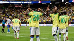 LAS VEGAS, NEVADA - JUNE 28: Savinho of Brazil celebrates with teammate Vinicius Junior after scoring the team's second goal during the CONMEBOL Copa America 2024 Group D match between Paraguay and Brazil at Allegiant Stadium on June 28, 2024 in Las Vegas, Nevada.   Kevork Djansezian/Getty Images/AFP (Photo by KEVORK DJANSEZIAN / GETTY IMAGES NORTH AMERICA / Getty Images via AFP)