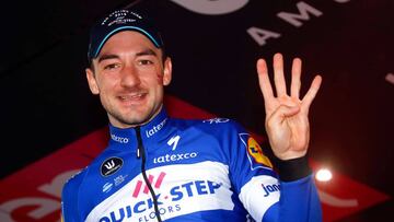 Italy's rider of team Quick-Step Elia Viviani celebrates on the podium after winning the 17th stage between Riva del Garda and Iseo of the 101st Giro d'Italia, Tour of Italy cycling race, on May 23, 2018. Italy's Elia Viviani of the Quick S