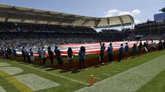 CARSON, CA - SEPTEMBER 08: A large American flag cover the field during pre-game festivities before the start of the Los Angeles Chargers season opens against Indianapolis Colts at Dignity Health Sports Park on September 8, 2019 in Carson, California.   Kevork Djansezian/Getty Images/AFP
== FOR NEWSPAPERS, INTERNET, TELCOS & TELEVISION USE ONLY ==