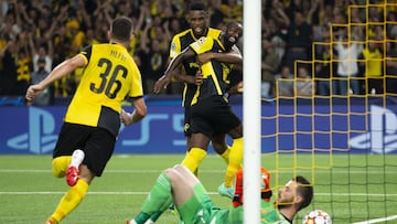 Nicolas Ngamaleu (C) celebrates with teammate Jordan Siebatcheu after scoring the equalizer against Manchester United. 