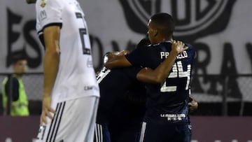 Cristian Palacios (R) of Peru&#039;s Sporting Cristal celebrates after scoring against Paraguay&#039;s Olimpia during their Copa Libertadores football match at Manuel Ferreira stadium in Asuncion, Paraguay, on May 9, 2019. (Photo by NORBERTO DUARTE / AFP)