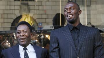(L-R) Former soccer player Pele and Olympic printer Usain Bolt pose during a ribbon cutting ceremony to celebrate the opening of the flagship "Hublot" store on Fifth Avenue in the Manhattan borough of New York, U.S., April 19, 2016. REUTERS/Andrew Kelly