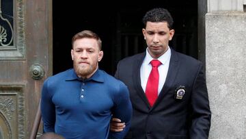 Mixed Martial Arts fighter Conor McGregor is escorted by New York City Police (NYPD) detectives from the 78th police precinct after charges were laid against him in the Brooklyn borough of New York City, U.S., April 6, 2018. 