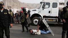 Police detain a demonstrator during a national transportation strike against fuel prices, in Lima, Peru March 18, 2021. REUTERS/Angela Ponce