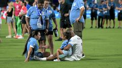 Uruguay's midfielder #07 Nicolas De La Cruz (R) gathers with his family after his team's defeat in the Conmebol 2024 Copa America tournament semi-final football match between Uruguay and Colombia at Bank of America Stadium, in Charlotte, North Caroline on July 10, 2024. (Photo by JUAN MABROMATA / AFP)
