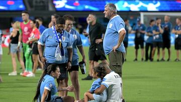 Uruguay's midfielder #07 Nicolas De La Cruz (R) gathers with his family after his team's defeat in the Conmebol 2024 Copa America tournament semi-final football match between Uruguay and Colombia at Bank of America Stadium, in Charlotte, North Caroline on July 10, 2024. (Photo by JUAN MABROMATA / AFP)
