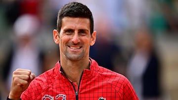 Serbia's Novak Djokovic reacts as he celebrates his victory over Norway's Casper Ruud during their men's singles final match on day fifteen of the Roland-Garros Open tennis tournament at the Court Philippe-Chatrier in Paris on June 11, 2023. (Photo by JULIEN DE ROSA / AFP)