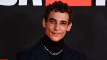 Spanish actor Miguel Herran poses during a photocall for the presentation of the last part of the fifth season of the Spanish TV show &quot;Money Heist&quot; (La Casa de Papel) at the Palacio Vistalegre arena in Madrid on November 30, 2021. (Photo by GABRIEL BOUYS / AFP)