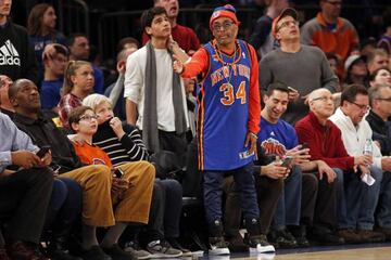 Wearing a Charles Oakley jersey director Spike Lee reacts during the second half against the San Antonio Spurs at Madison Square Garden.