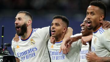 MADRID, SPAIN - MARCH 09: Karim Benzema of Real Madrid and teammates celebrate following their side's victory in the UEFA Champions League Round Of Sixteen Leg Two match between Real Madrid and Paris Saint-Germain at Estadio Santiago Bernabeu on Marc