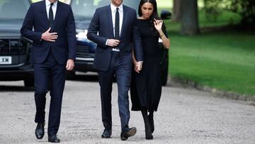 Britain's William, Prince of Wales, Prince Harry and Meghan, the Duchess of Sussex, walk outside Windsor Castle, following the passing of Britain's Queen Elizabeth, in Windsor, Britain, September 10, 2022. REUTERS/Peter Nicholls