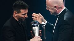 Argentina and Paris Saint-Germain forward Lionel Messi (L) receives from FIFA President Gianni Infantino the Best FIFA Men�s Player award during the Best FIFA Football Awards 2022 ceremony in Paris on February 27, 2023. (Photo by FRANCK FIFE / AFP)