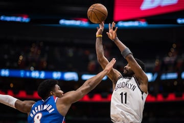 WASHINGTON, DC - JANUARY 19: Kyrie Irving #11 of the Brooklyn Nets shoots the ball over Rui Hachimura #8 of the Washington Wizards during the second half at Capital One Arena on January 19, 2022 in Washington,