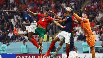 Soccer Football - FIFA World Cup Qatar 2022 - Semi Final - France v Morocco - Al Bayt Stadium, Al Khor, Qatar - December 14, 2022 Morocco's Jawad El Yamiq in action with France's Ibrahima Konate, Raphael Varane and Hugo Lloris REUTERS/Lee Smith