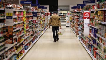 A shopper walks along an aisle inside a Tesco supermarket in Manchester, Britain, February 5, 2026 REUTERS/Phil Noble