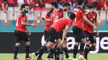 Egypt's forward Mohamed Salah (L) celebrates with teammates after scoring his team's first goal during the Africa Cup of Nations (CAN) 2021 quarter-final football match between Egypt and Morocco at Stade Ahmadou Ahidjo in Yaounde on January 30,