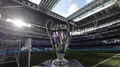 This photograph shows the Champions League trophy put on display on the side of the pitch the UEFA Champions League semi-final first leg football match between Real Madrid CF and Manchester City at the Santiago Bernabeu stadium in Madrid on May 9, 2023. (Photo by Thomas COEX / AFP)