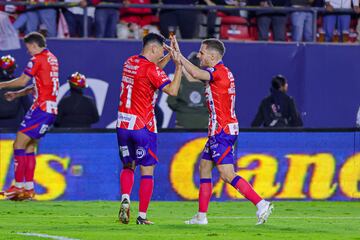   Leonardo Bonatini celebrates his goal 1-0 with Sebastien Salles-Lamonge of San Luis during the Semifinal first leg match between Atletico de San Luis and Monterrey  as part of the Liga BBVA MX, Torneo Apertura 2024 at Alfonso Lastras Stadium on December 04, 2024 in San Luis Potosi, Mexico.