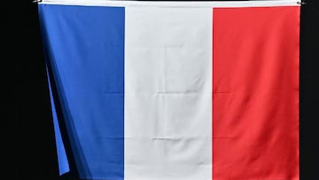 France&#039;s national flag raised up during the medal ceremony for the menx92s team foil at the Tokyo 2020 Olympic Games at the Makuhari Messe Hall in Chiba City, Chiba Prefecture, Japan, on August 1, 2021. (Photo by Fabrice COFFRINI / AFP)