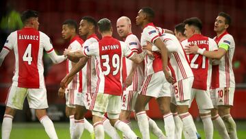 AMSTERDAM, NETHERLANDS - MARCH 11: Davy Klaassen of Ajax celebrates with Antony and teammates after scoring their team's first goal during the UEFA Europa League Round of 16 First Leg match between Ajax and BSC Young Boys at Johan Cruijff Arena on M